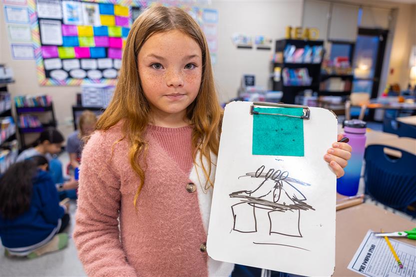 Students do a pumpkin STEM challenge